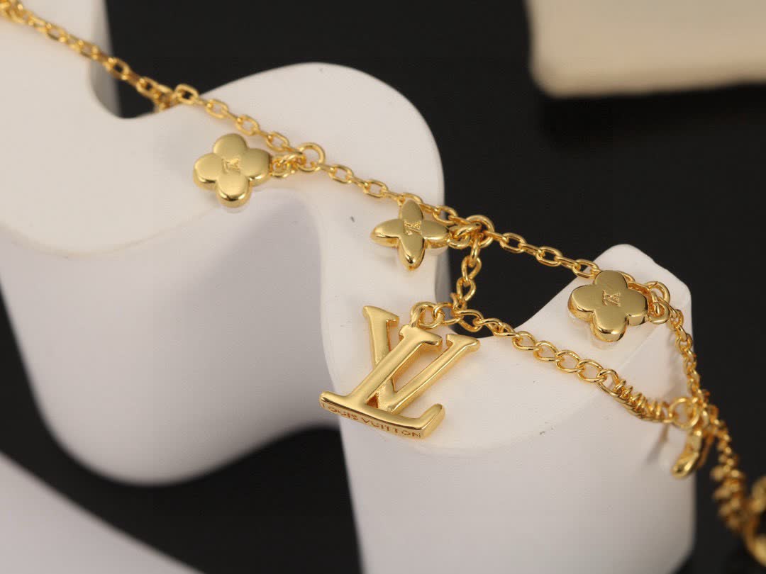 Louis Vuitton Gold Tone Bracelet with Pearls and Logo